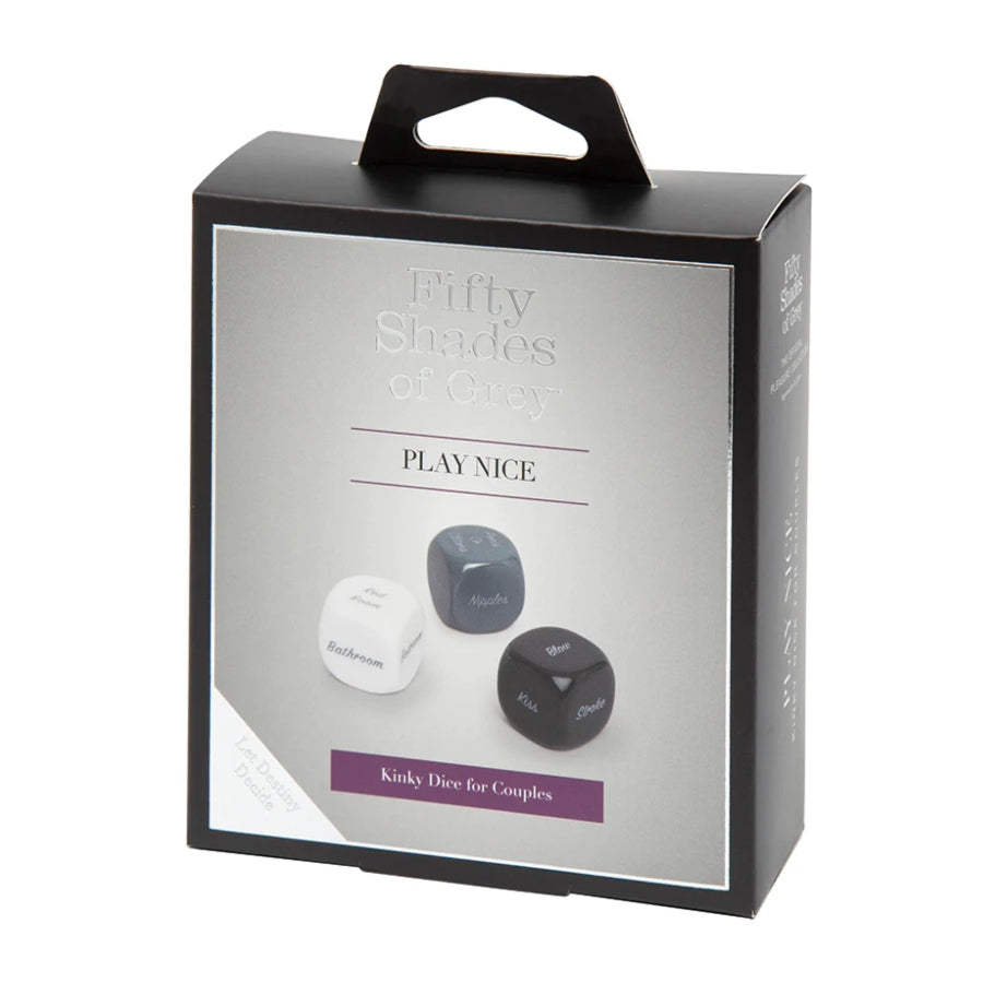 Fifty Shades of Grey Play Nice Role Play Dice set featuring three black dice with white text, each showing a category: action, body part, and location β designed to inspire romantic and playful scenarios.