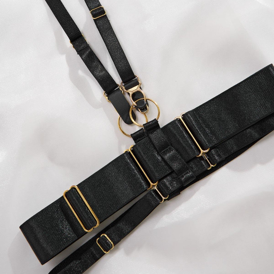 Capri Lace Lingerie Set with floral lace bra, thong and suspender belt displayed flat.