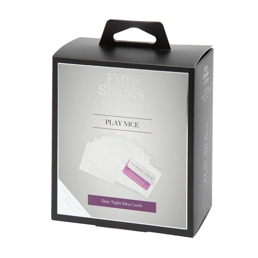Fifty Shades of Grey Play Nice Date Night Idea Cards set featuring a box with a handle, accompanied by two open cards labeled 'Staying In' and 'Going Out', each revealing a purple or blue suggestion for romantic activities.