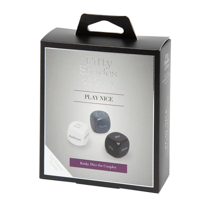 Fifty Shades of Grey Play Nice Role Play Dice set featuring three black dice with white text, each showing a category: action, body part, and location — designed to inspire romantic and playful scenarios.
